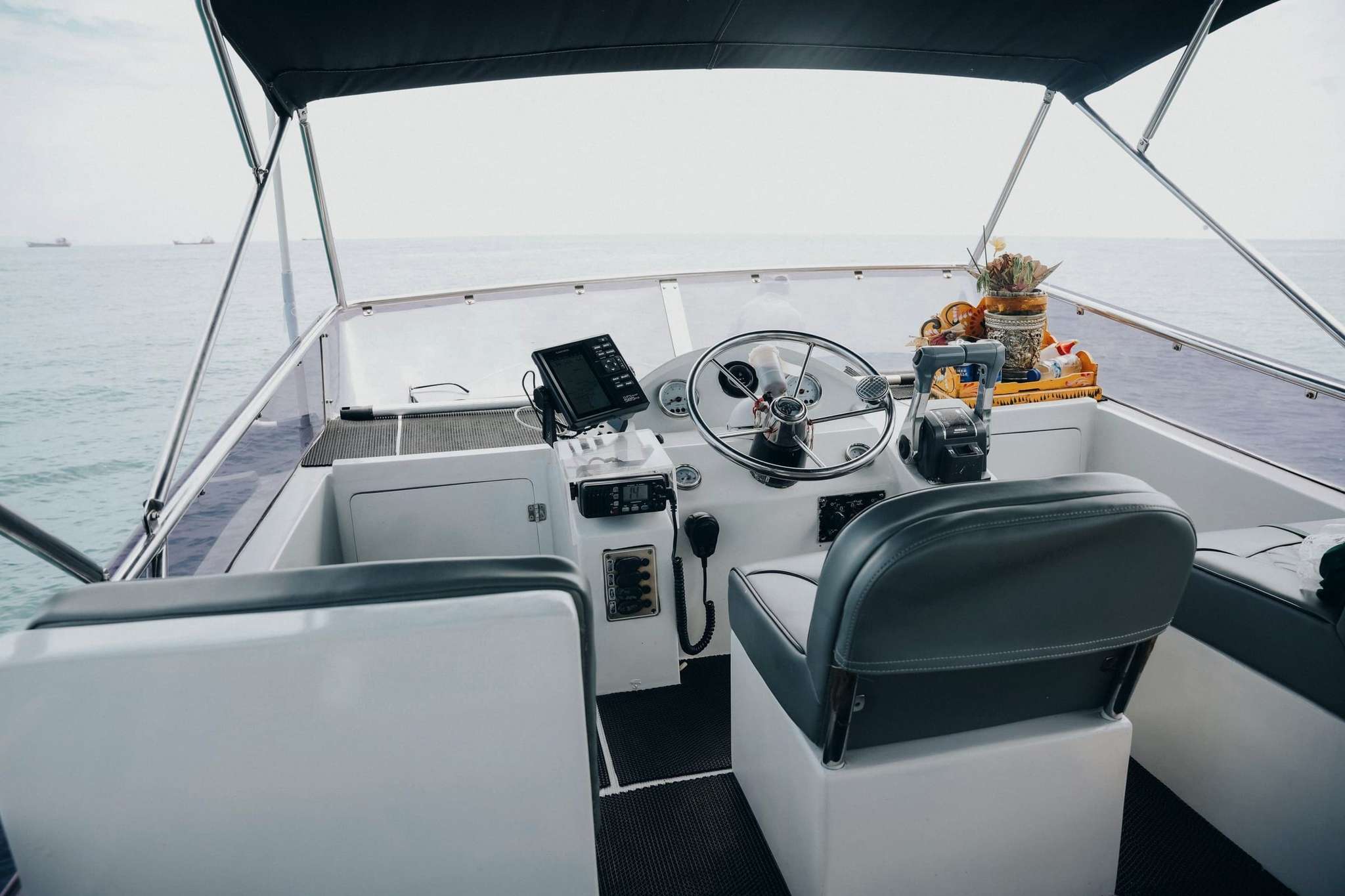 Flybridge helm station aboard Freedom Yacht