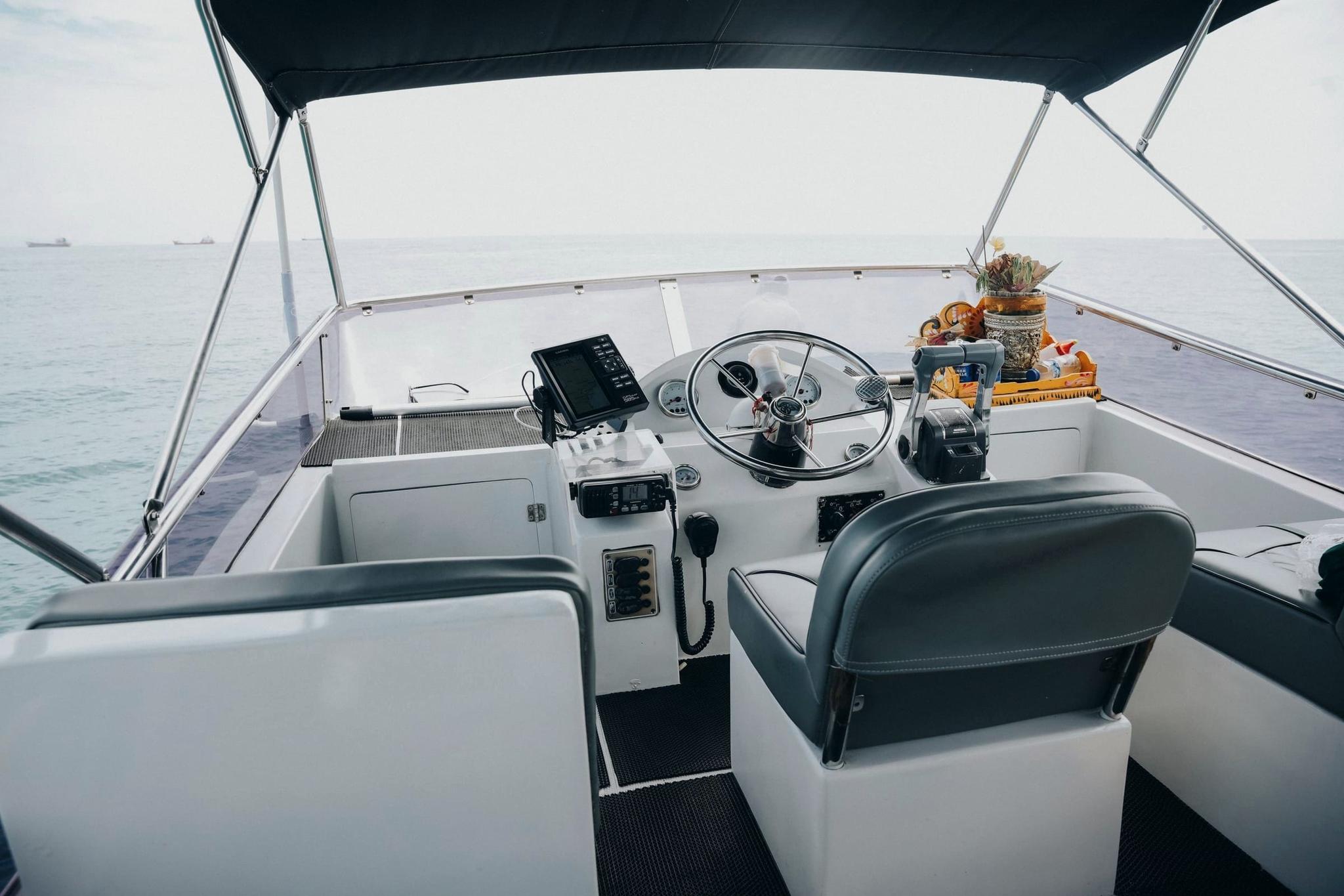 Flybridge helm station aboard Freedom Yacht